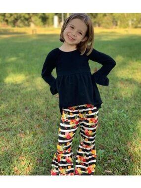 Adorable Girl's 0-3 months Solid Black Criss-Cross back Ruffled sleeve shirt